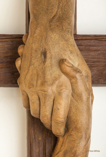 Tom White Studios, Inc | Cross Sculptures Calvary Jesus Rescued Statue Close-up rescued cross showing grasping hands