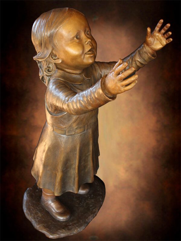 Top view bronze girl sculpture with outstretched arms