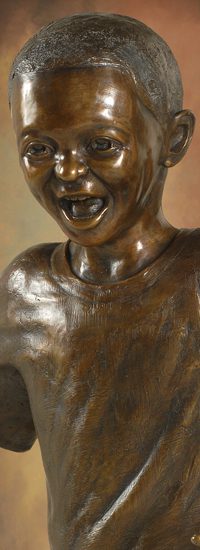 Tom White Studios, Inc | Children & Adults Figurative Bronze Statues Bronze sculpture of laughing boy's smiling face