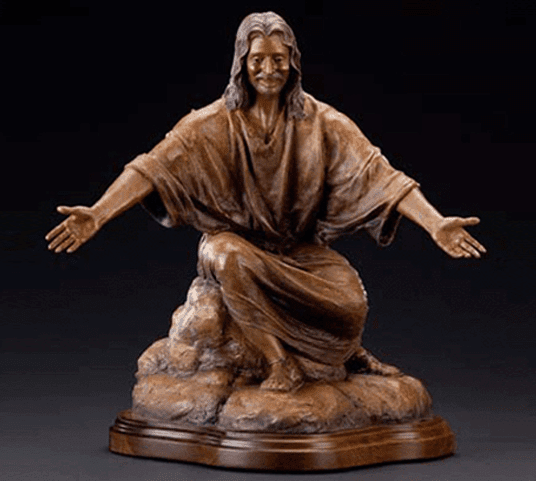 Welcoming bronze Jesus with outstretched arms