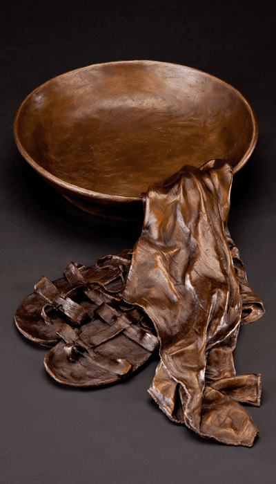 Bronze bowl, towel and sandals arrangement