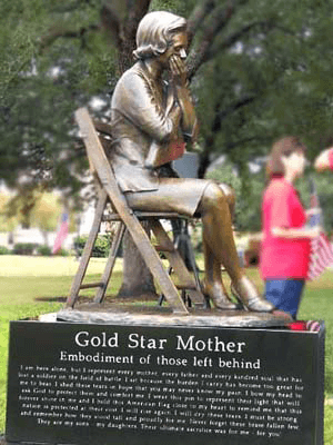 Gold Star mother on folding chair