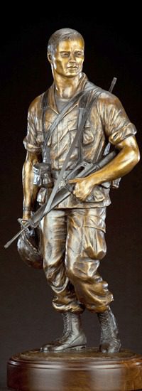 Bronze rifle-bearing soldier holding helmet