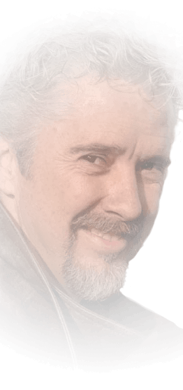Cropped smiling face with salt-and-pepper beard