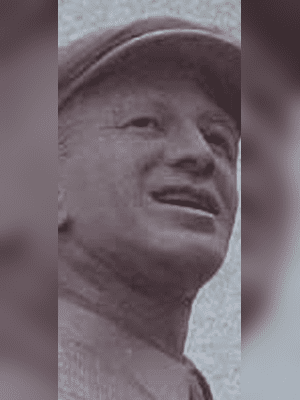 Bronze golfer portrait, cap visible