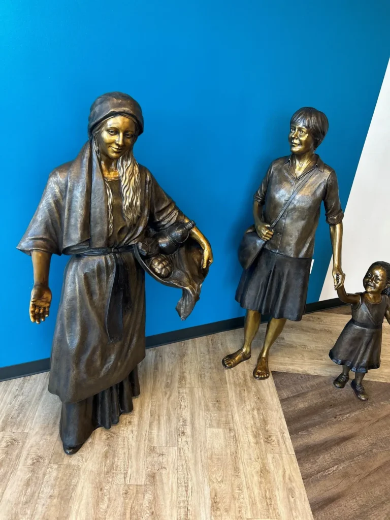 TSaint Angela Merici Statue & Dorothy Kazel bronze portrait sculpture scene commissioned by Urban Community School and created by Tom White, Sculptor. St Angela Merici was the founder of the Ursuline nuns in the 1400&rsquo;s