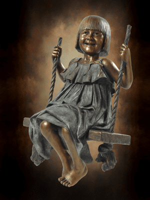 Tom White Studios, Inc | Jesus Statues Bronze girl on swing with joyful expression