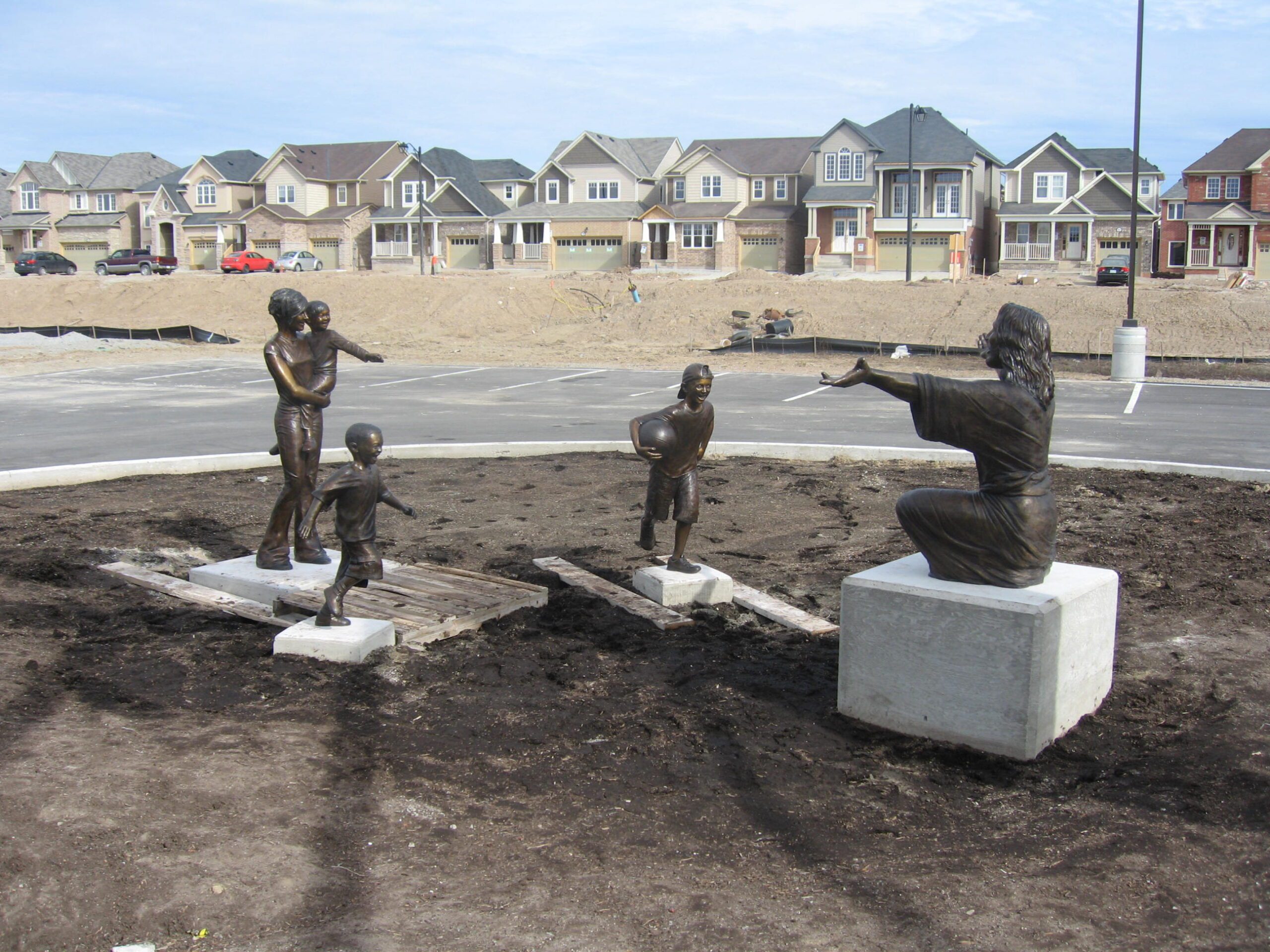 Tom White Studios, Inc | Jesus Statues Welcome the Children sculpture scene of Jesus and kids at the New Life Youth Center, Milton, Ontario Canada. Created by commissioned sculptor, Tom White.